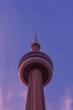 Stunning view of Toronto's CN Tower during twilight with a colorful sky backdrop.