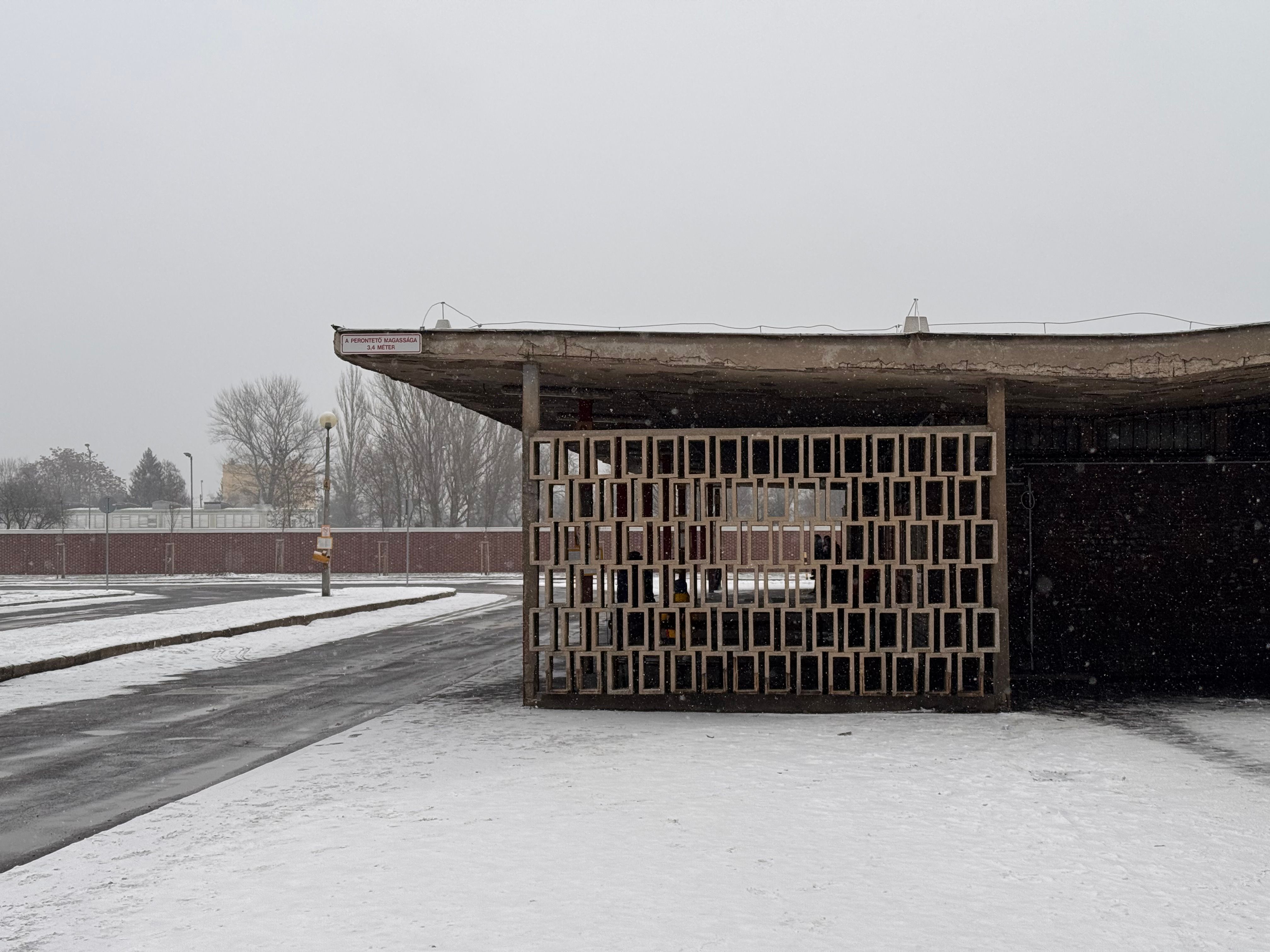 A stark example of brutalist architecture in snowy Kazincbarcika, Hungary.