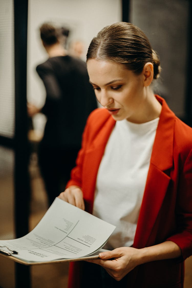 Woman Reading Papers