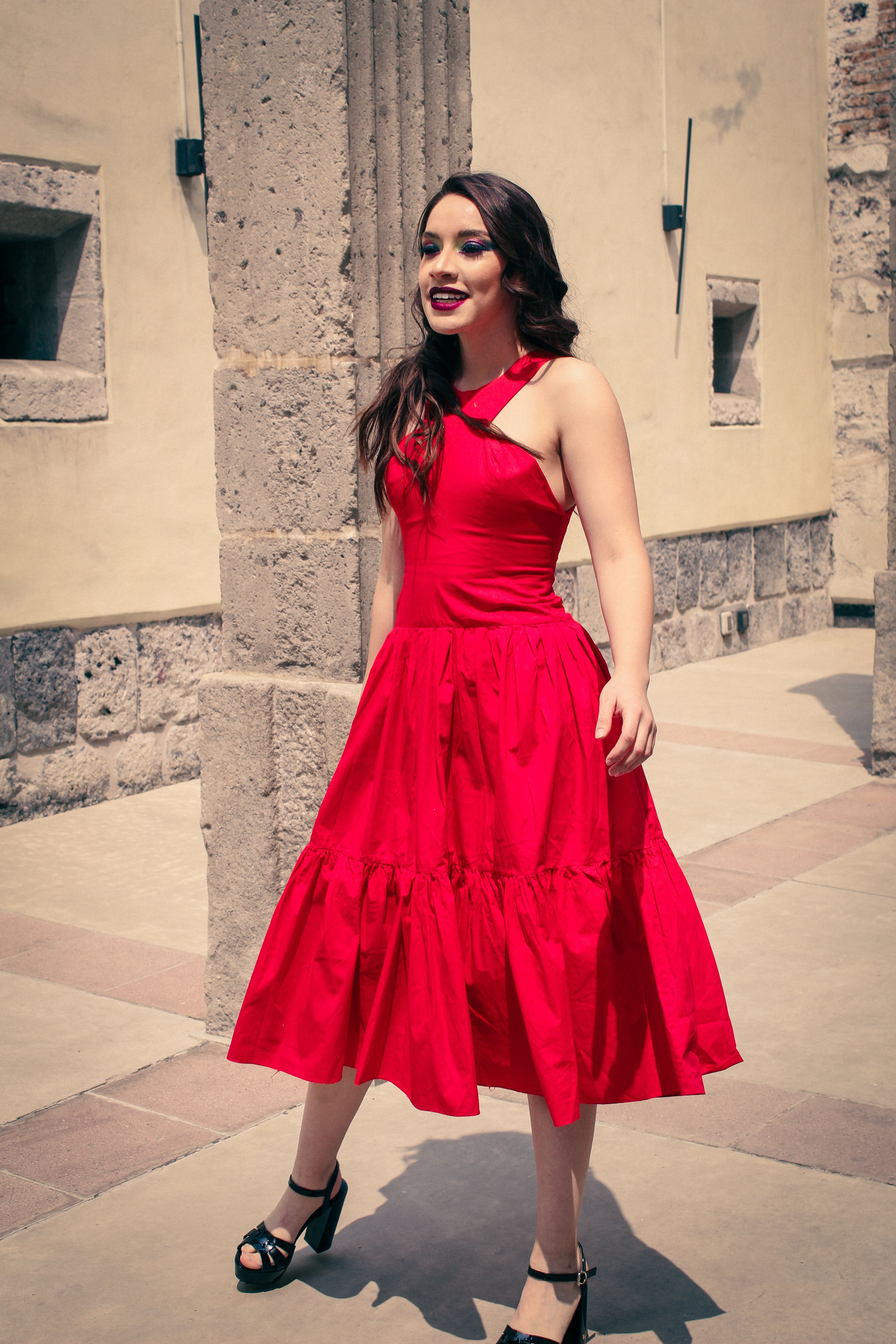 Elegant Woman in Red Dress Walking Outdoors · Free Stock Photo