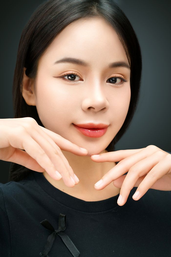 Warmly lit beauty portrait emphasizing radiant skin