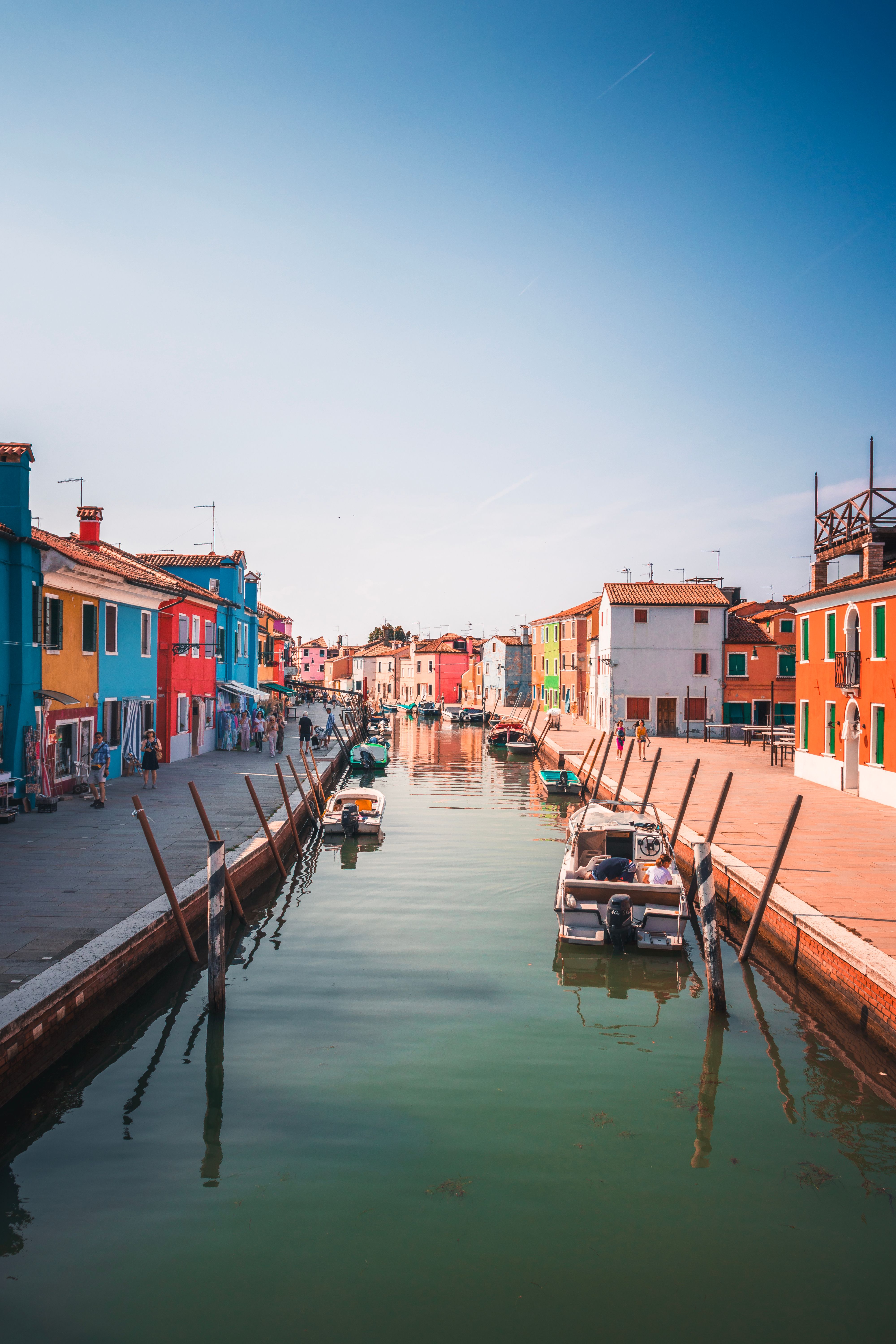 Scenic view of the vibrant houses along Burano's canal in Venice, Italy. Perfect travel spot.