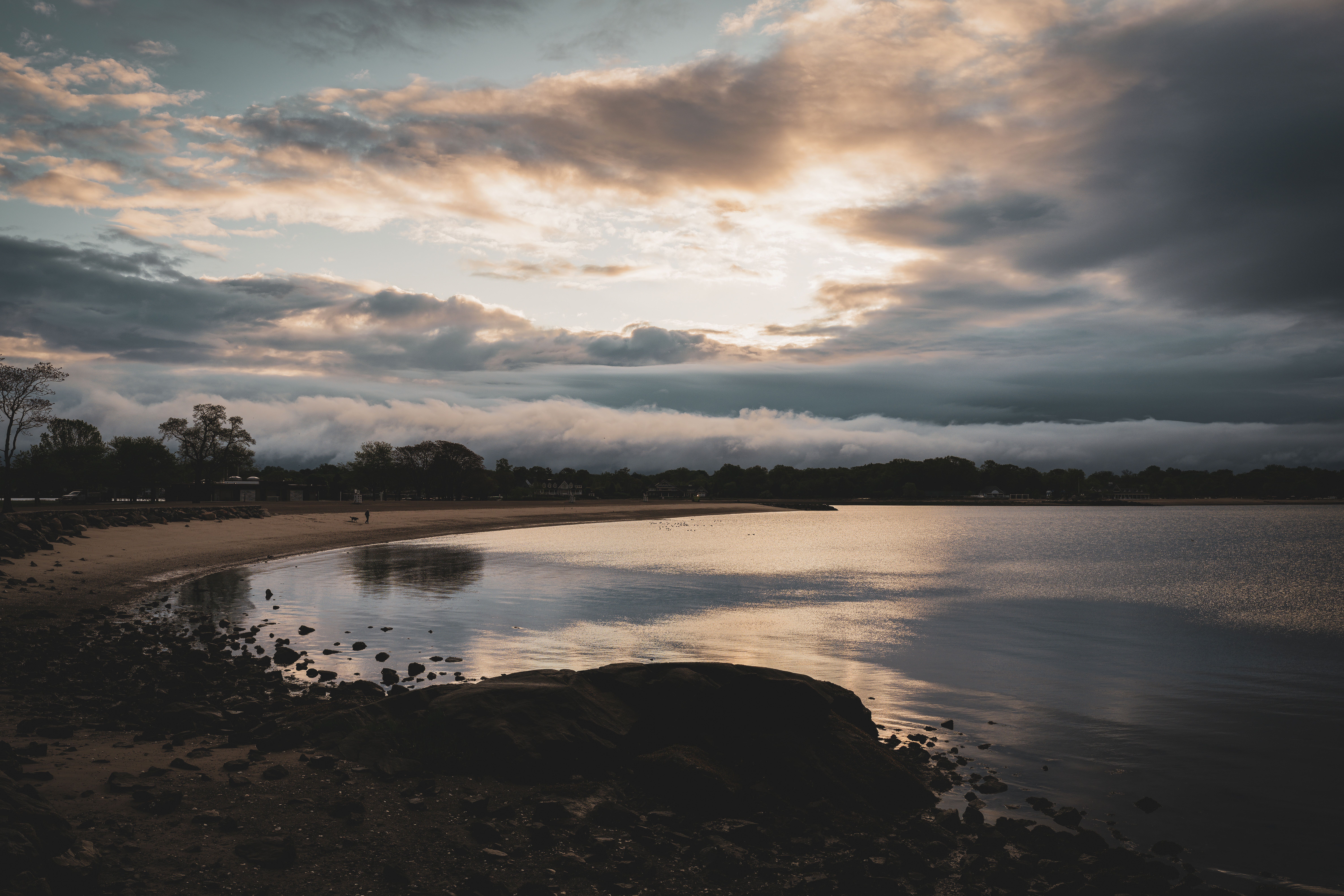 Tranquil sunrise over Cove Island Park, Stamford, reflecting on the serene waters.