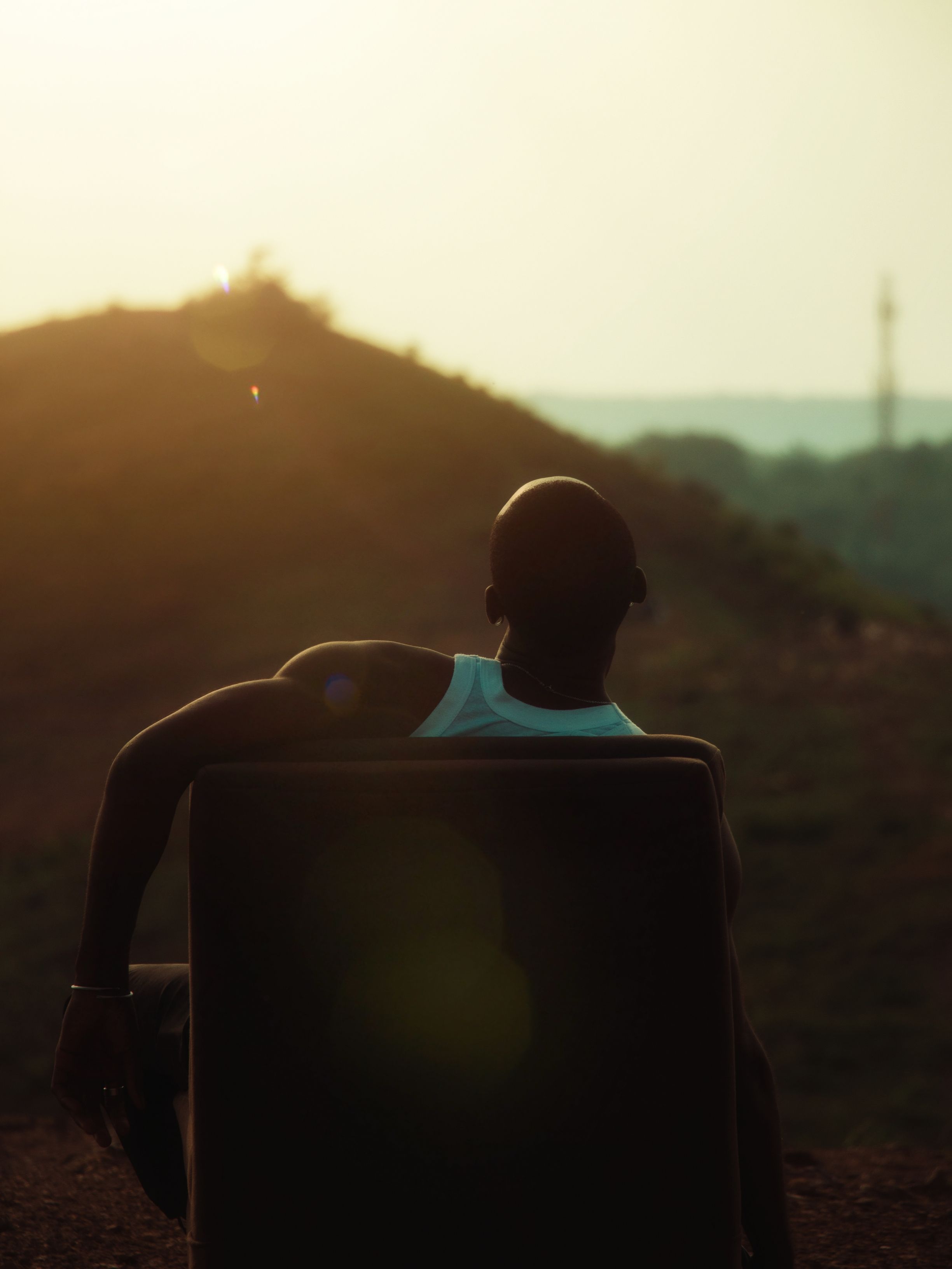 Contemplative Man Enjoying Sunset Outdoors · Free Stock Photo
