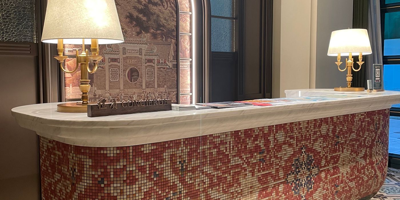 A hotel reception desk where resort fees are added to the bill