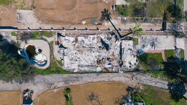 Aerial shot of a house destroyed by wildfire in Altadena, California.