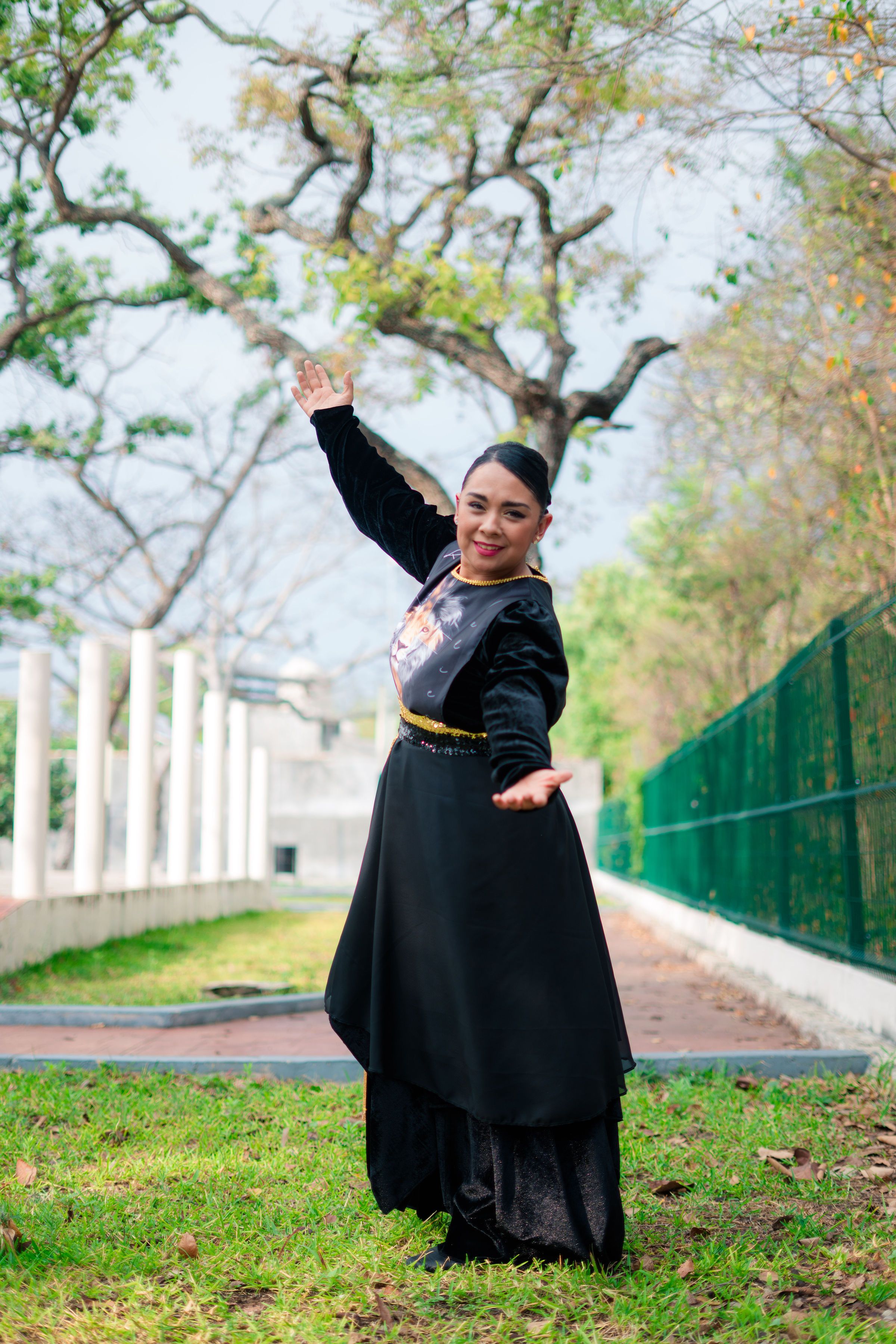 Woman in Traditional Dress Posing Outdoors · Free Stock Photo