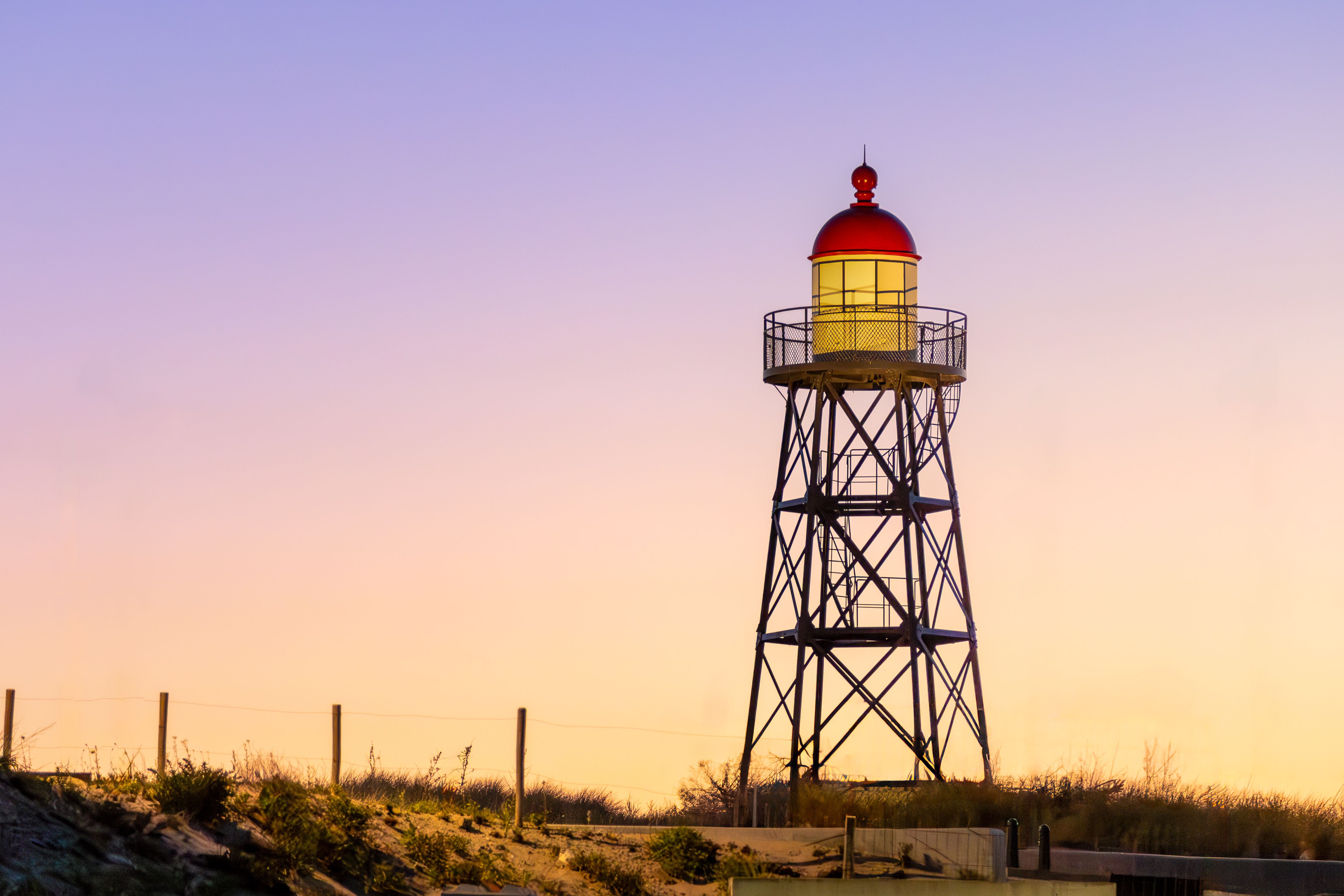 Scenic Sunset at Historic Dutch Lighthouse · Free Stock Photo