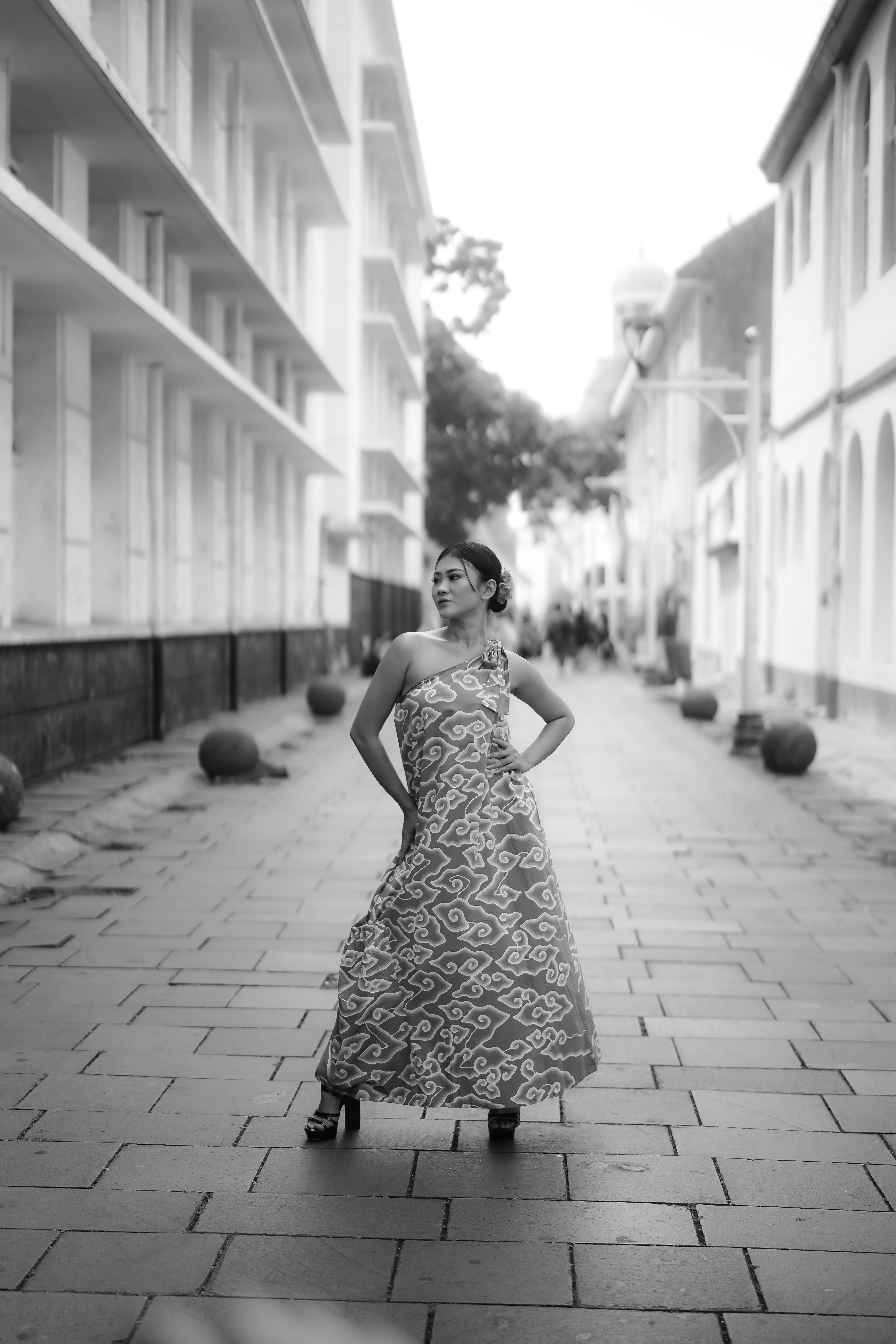 Elegant Woman Posing in Urban Street Setting · Free Stock Photo