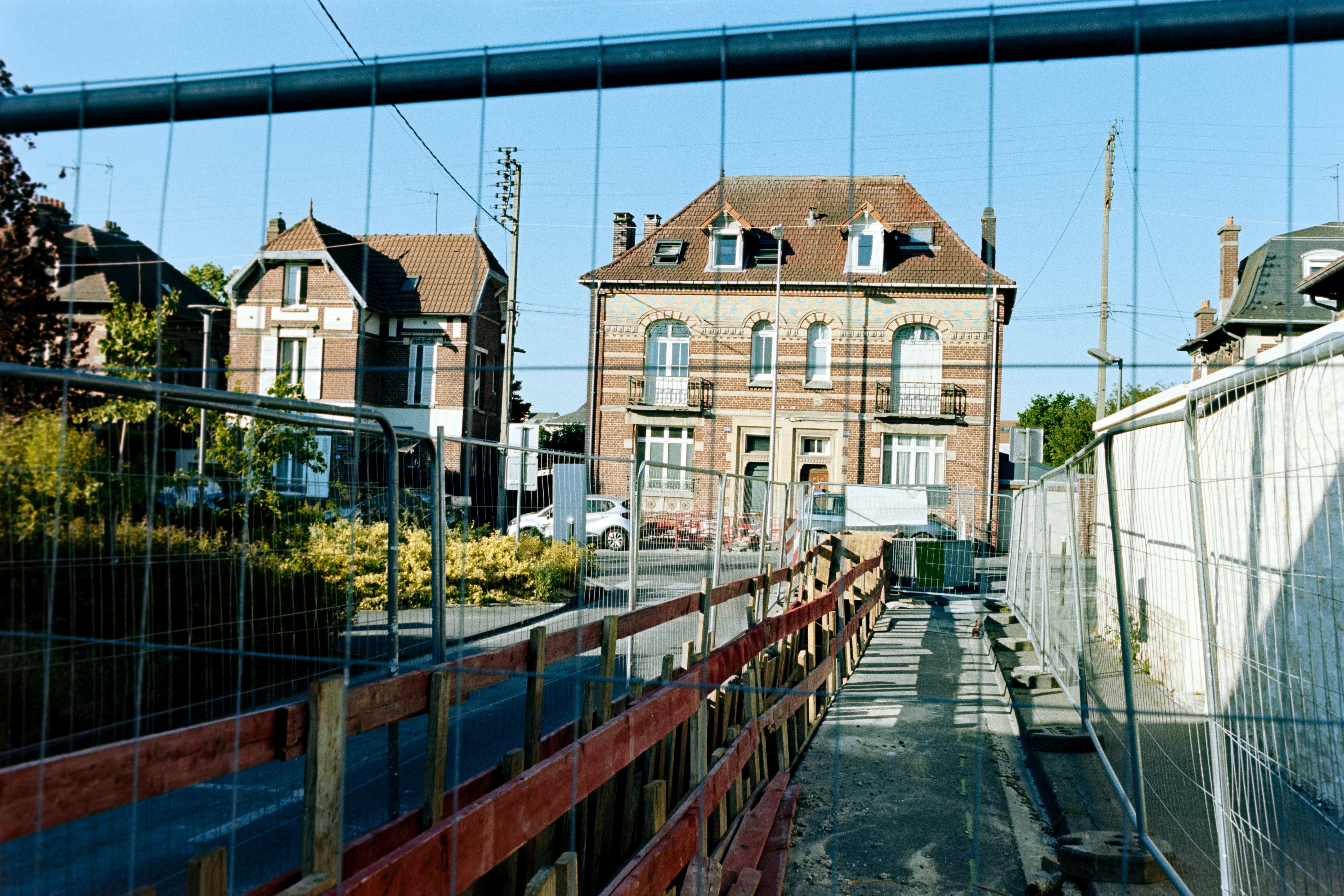 Historic French Architecture with Construction Fencing · Free Stock Photo