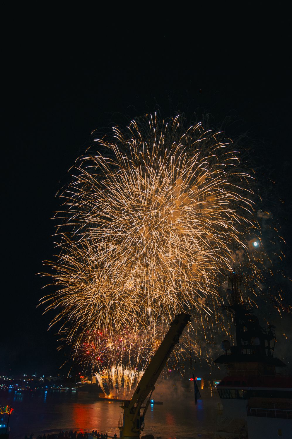 Spectacular Fireworks Display Over Water at Night · Free Stock Photo