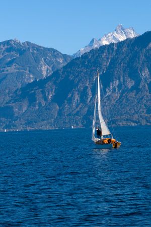 Sailboat on an alpine lake — photo by Jean-Paul Wettstein on Pexels