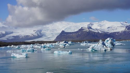 Free Stunning view of icebergs floating in Jökulsárlón Glacier Lagoon under a clear sky in Iceland. Stock Photo