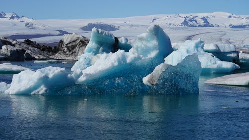 Free Stunning view of icebergs floating in Jokulsarlon Glacier Lagoon, Iceland, showcasing glacial beauty. Stock Photo