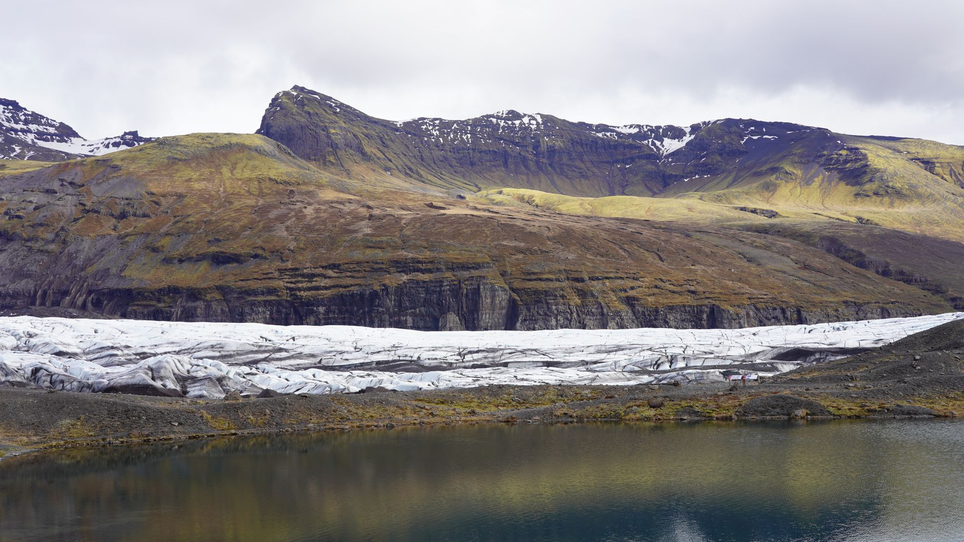 Hikers roped up on a blue glacier in Iceland