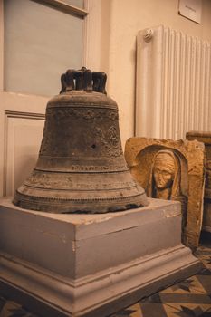 A close-up of an antique bell and sculpture inside a museum in Istanbul, Türkiye.