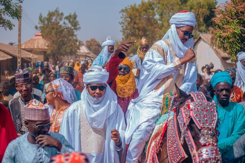 Free Vibrant outdoor scene of people in traditional attire during a cultural festival. Stock Photo