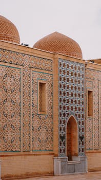 Detailed mosaic and tile work on a historical mausoleum in Samarkand, Uzbekistan.