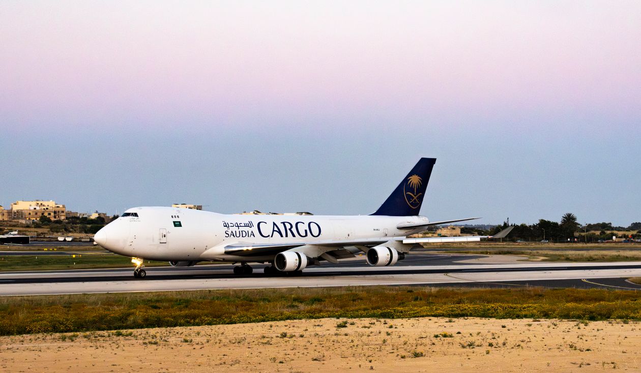 Cargo plane on the runway during twilight