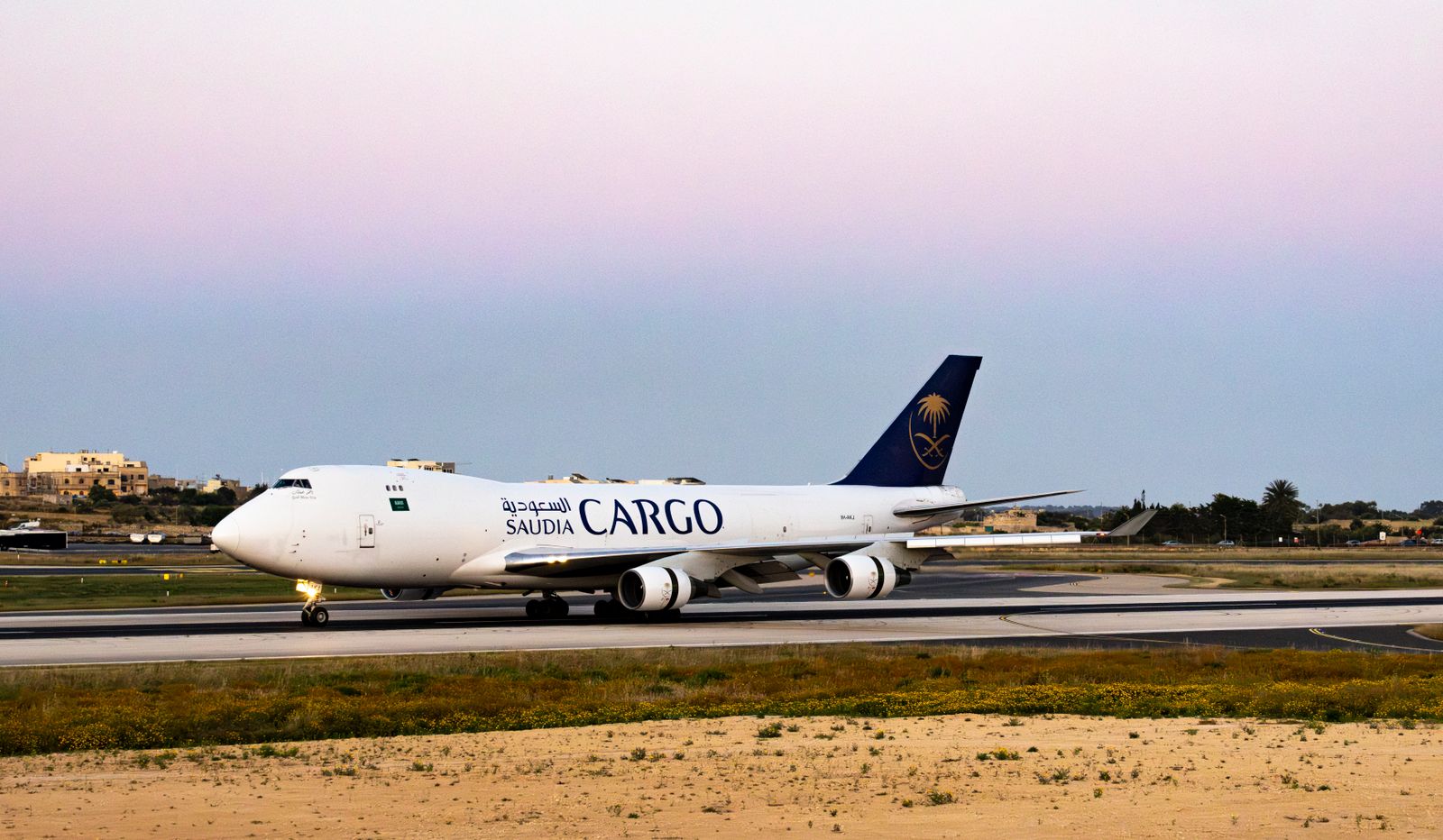 Cargo plane on the runway during twilight