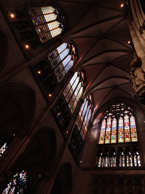 Free Interior of Cologne Cathedral showcasing its magnificent Gothic stained glass windows. Stock Photo