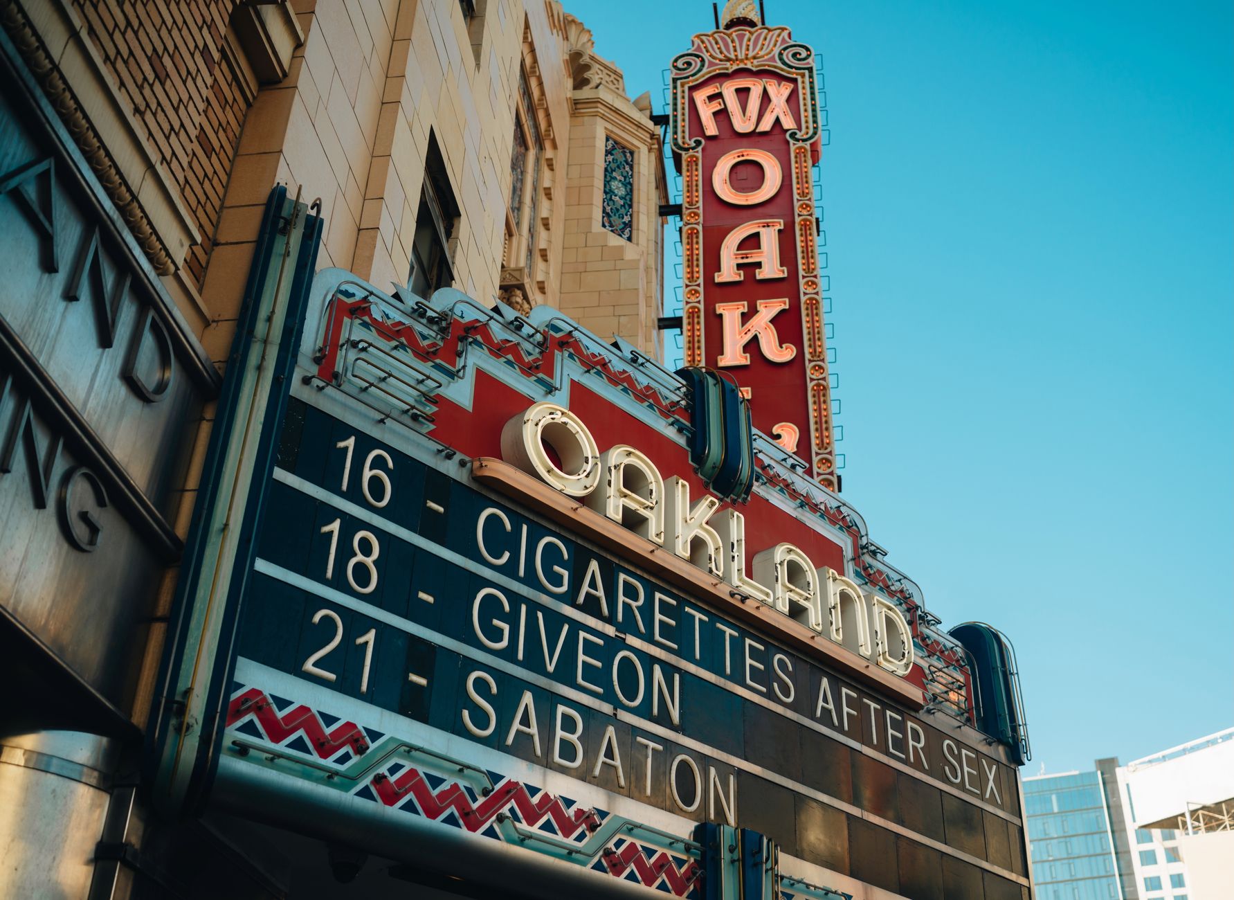 Exterior shot of the Fox Theater marquee in Oakland, California featuring upcoming events.