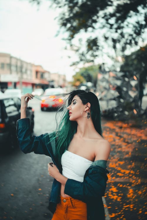 Free Woman in Blue Denim Jacket and White Crop Top Stock Photo