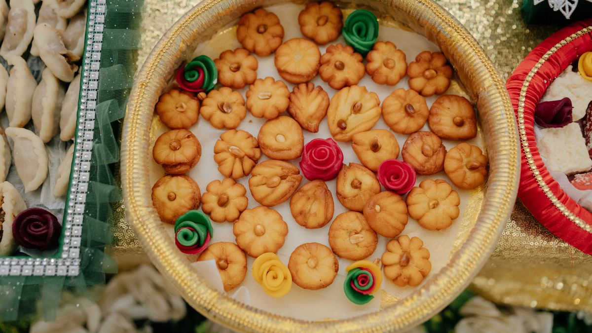Golden tray of traditional sweets (Gruhapravesam Catering in Vellore)