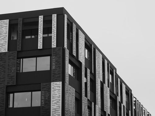 Free Contemporary architectural design of a building with geometric patterns in black and white. Stock Photo