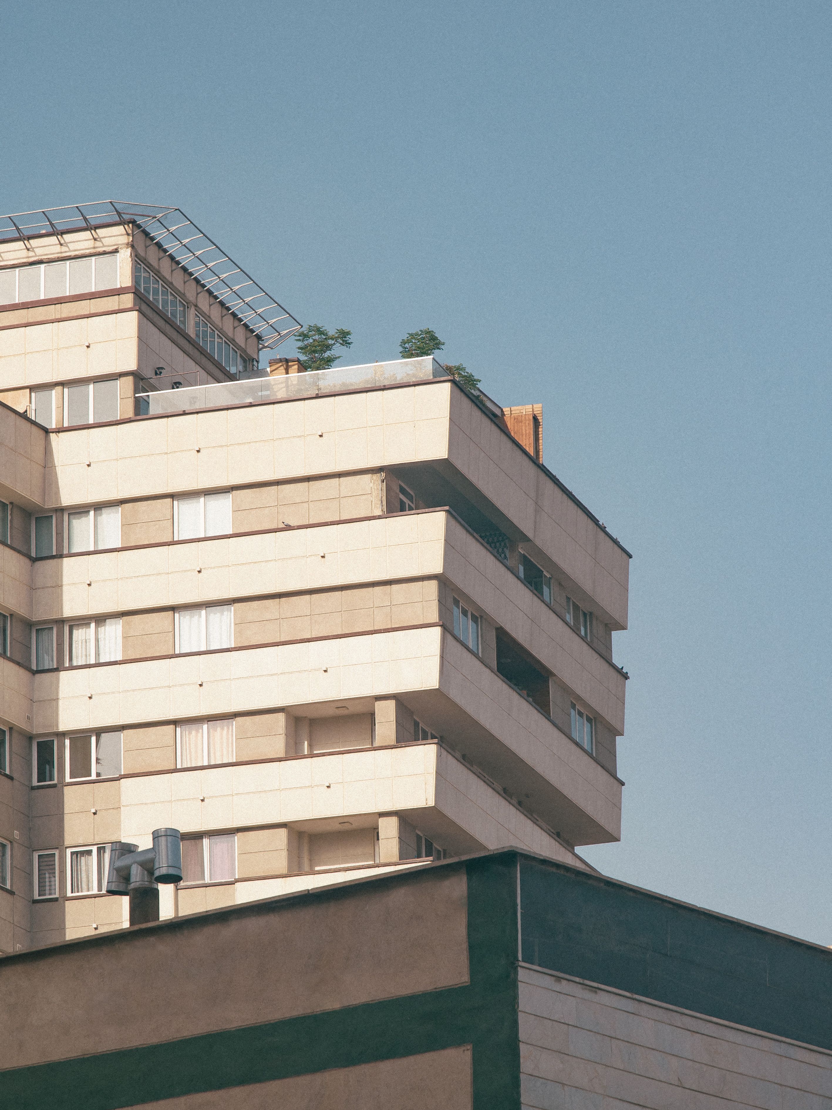 Modern Residential Building Facade in Sunlight · Free Stock Photo