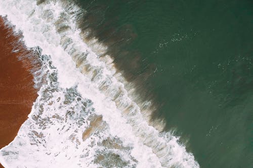 Aerial Photography of Waves Splashing on Seashore