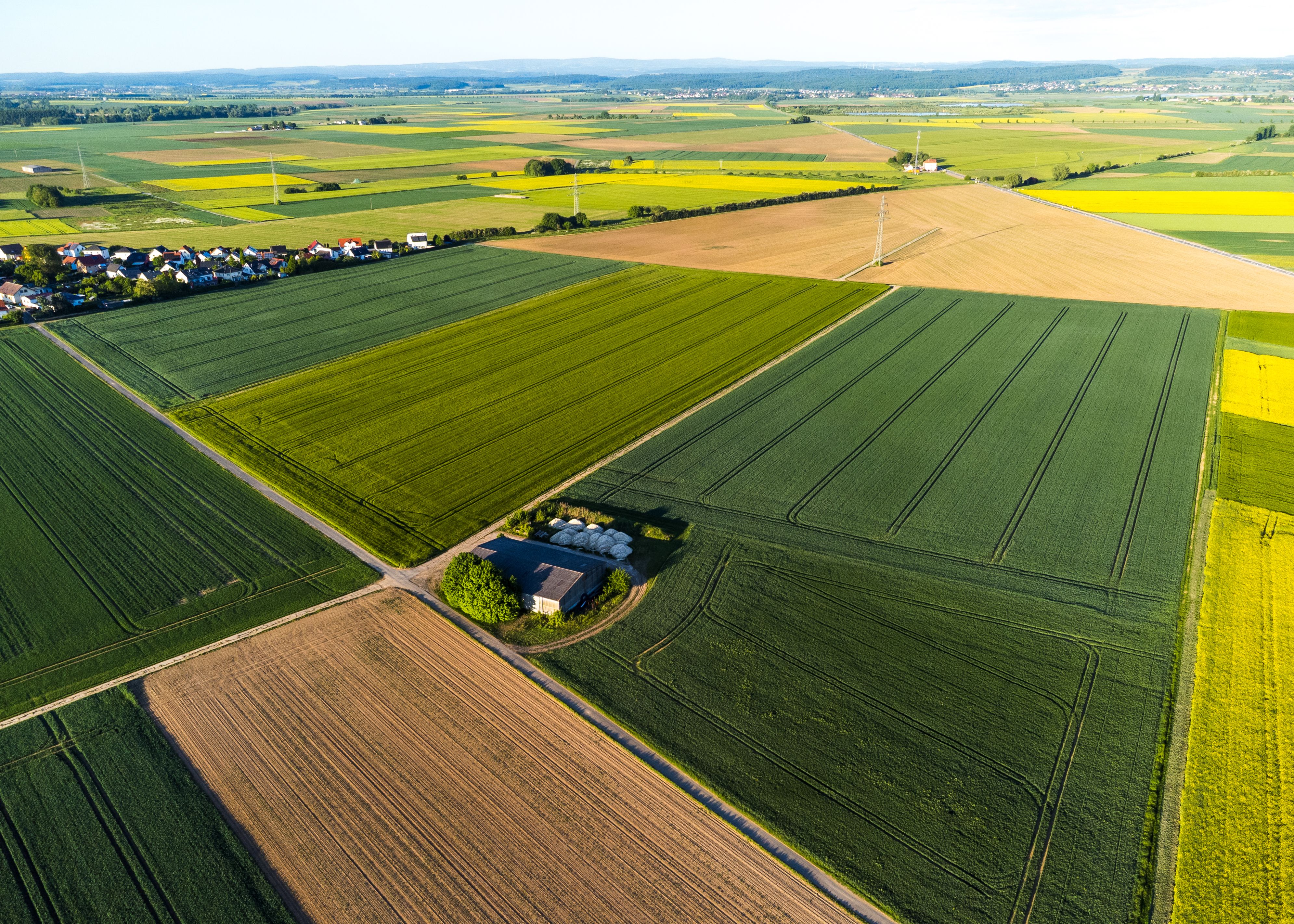 Aerial View of Lush Agricultural Fields in Summer · Free Stock Photo