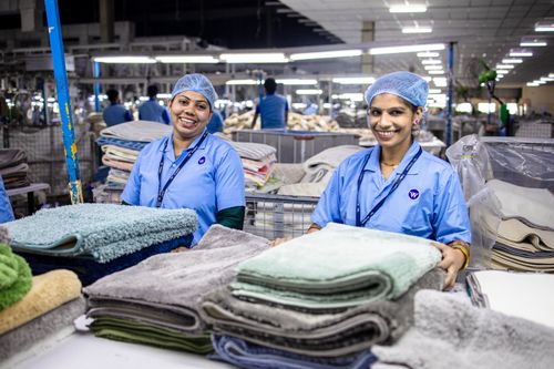 Workers processing hair in modern facility