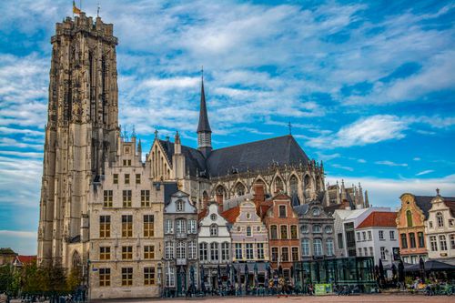 Free St. Rumbold's Cathedral in Mechelen, Belgium, showcasing vibrant Dutch architecture. Stock Photo