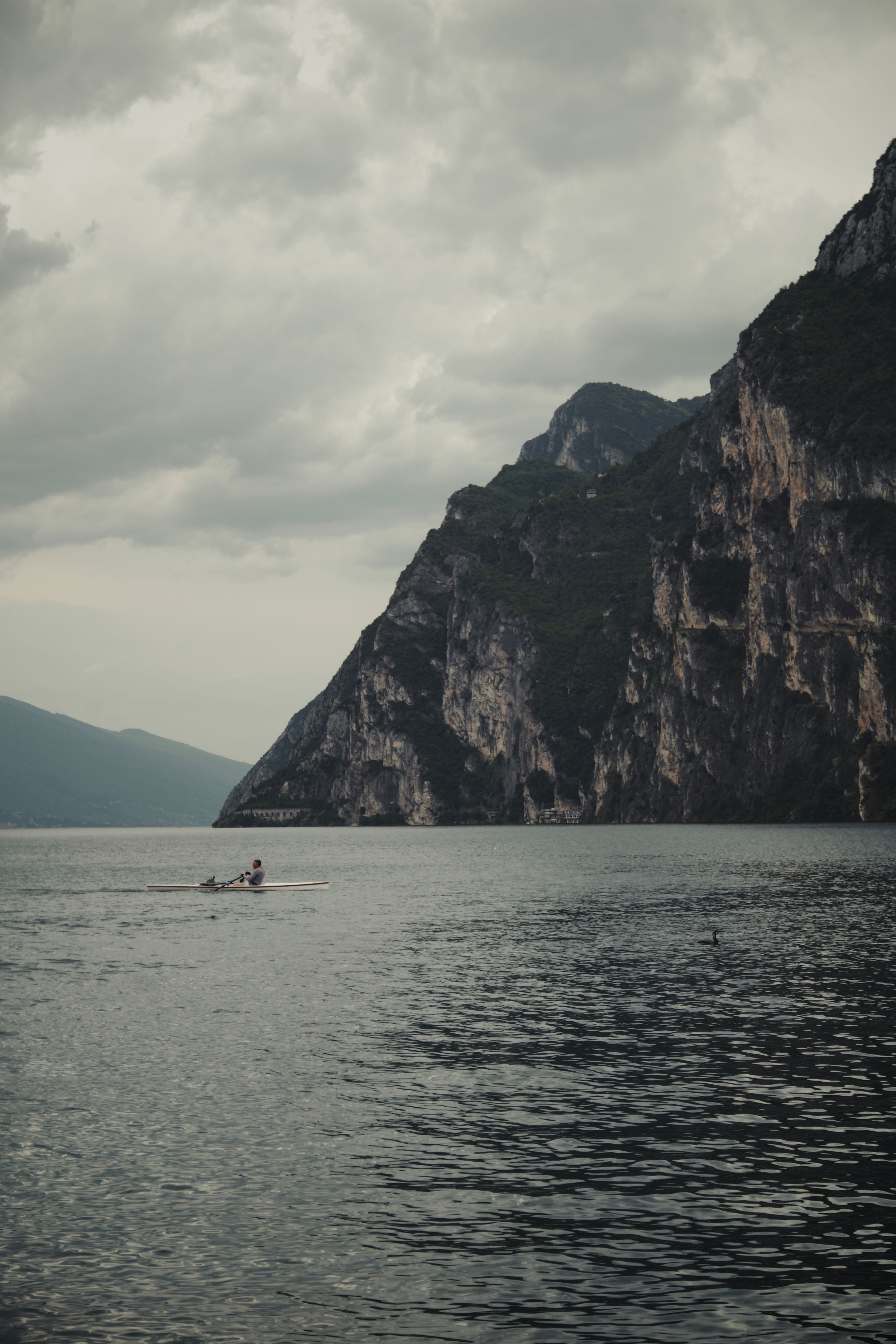 Tranquil Rowing Scene by Majestic Cliffs · Free Stock Photo