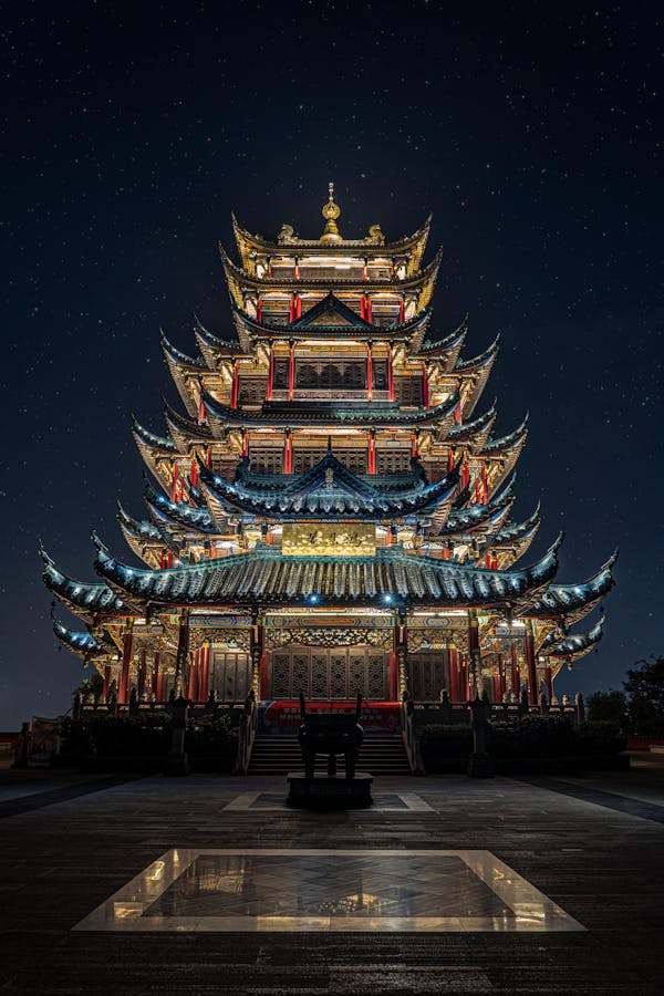 Blue, Yellow, and Green Lighted Pagoda Tower