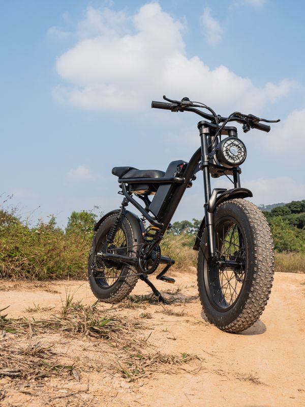 Fat tire electric bike on dirt path outdoors