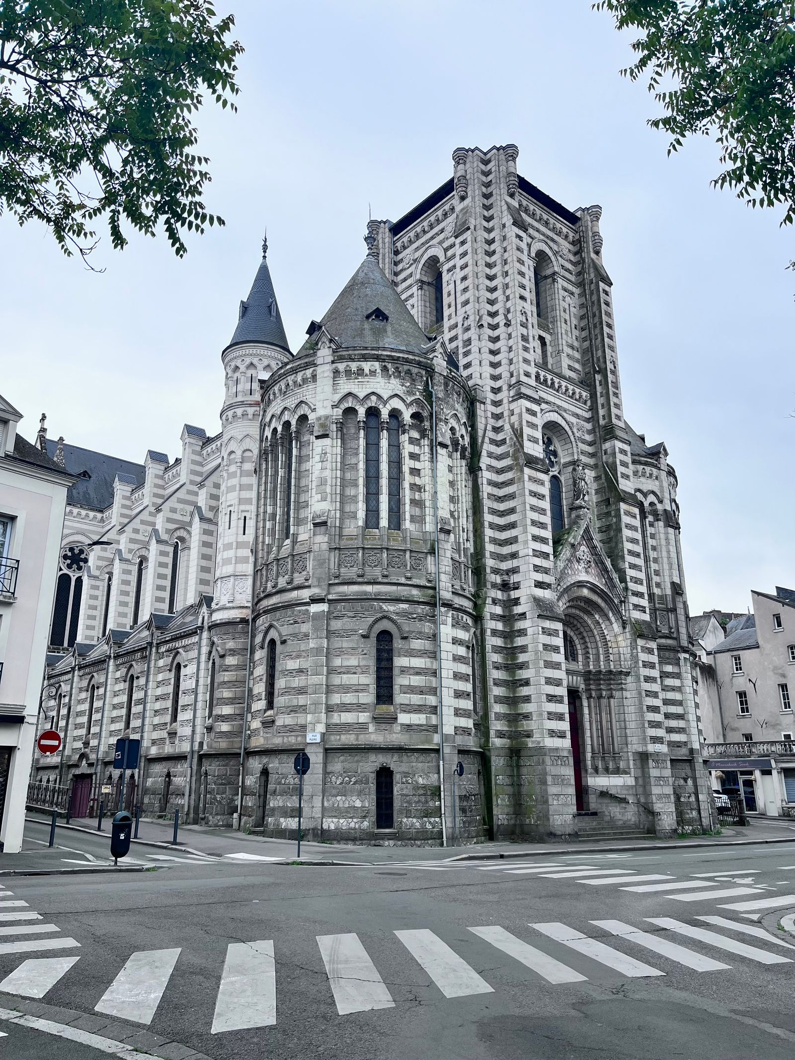 Stunning view of Saint-Maurice Cathedral in Angers, France, showcasing Romanesque Revival architecture in an urban setting