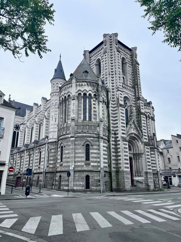 Stunning view of Saint-Maurice Cathedral in Angers, France, showcasing Romanesque Revival architecture in an urban setting