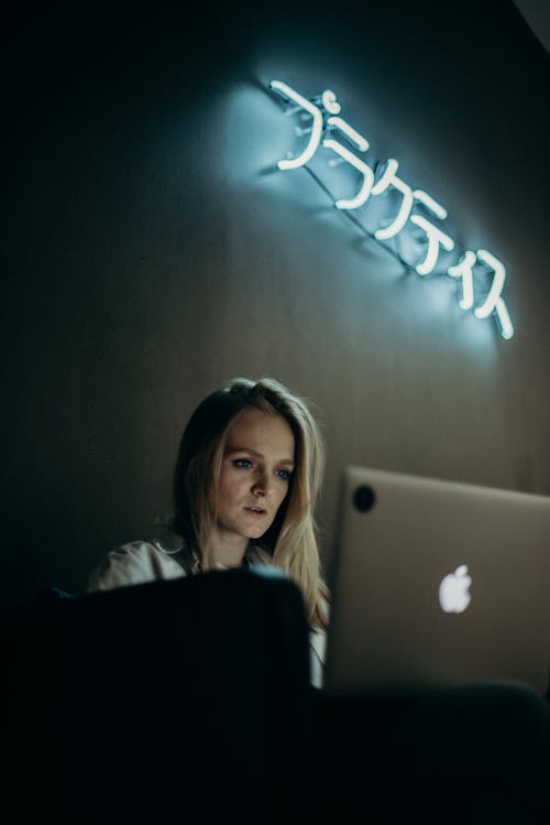 Woman Looking at Macbook