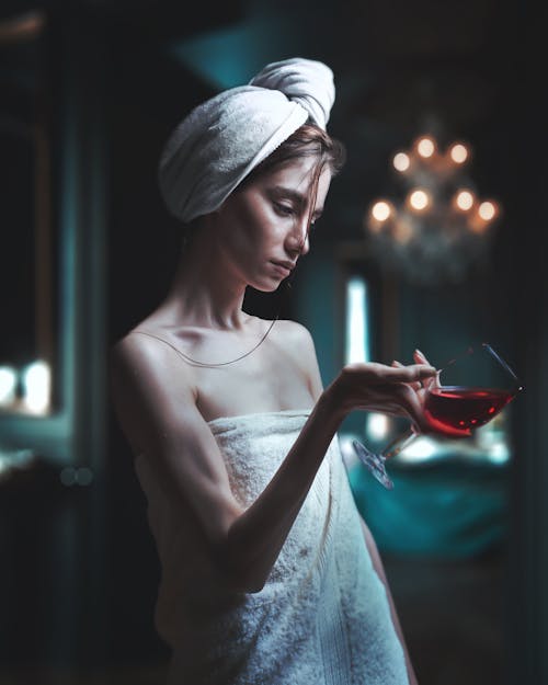 Woman in White Towel Holding Wine Glass 