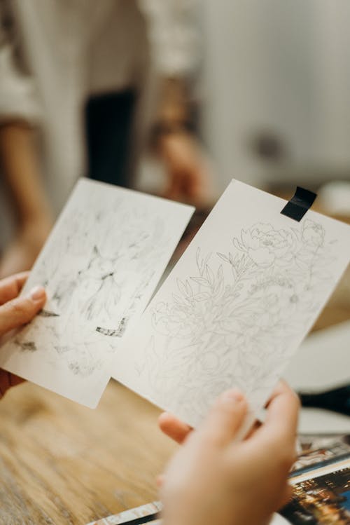 Free Person Holding Paper Sketch Stock Photo