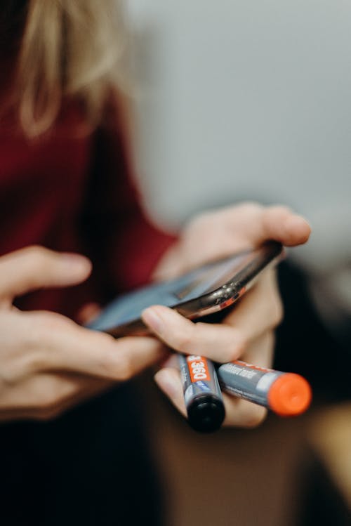 Person Using Gray Smartphone