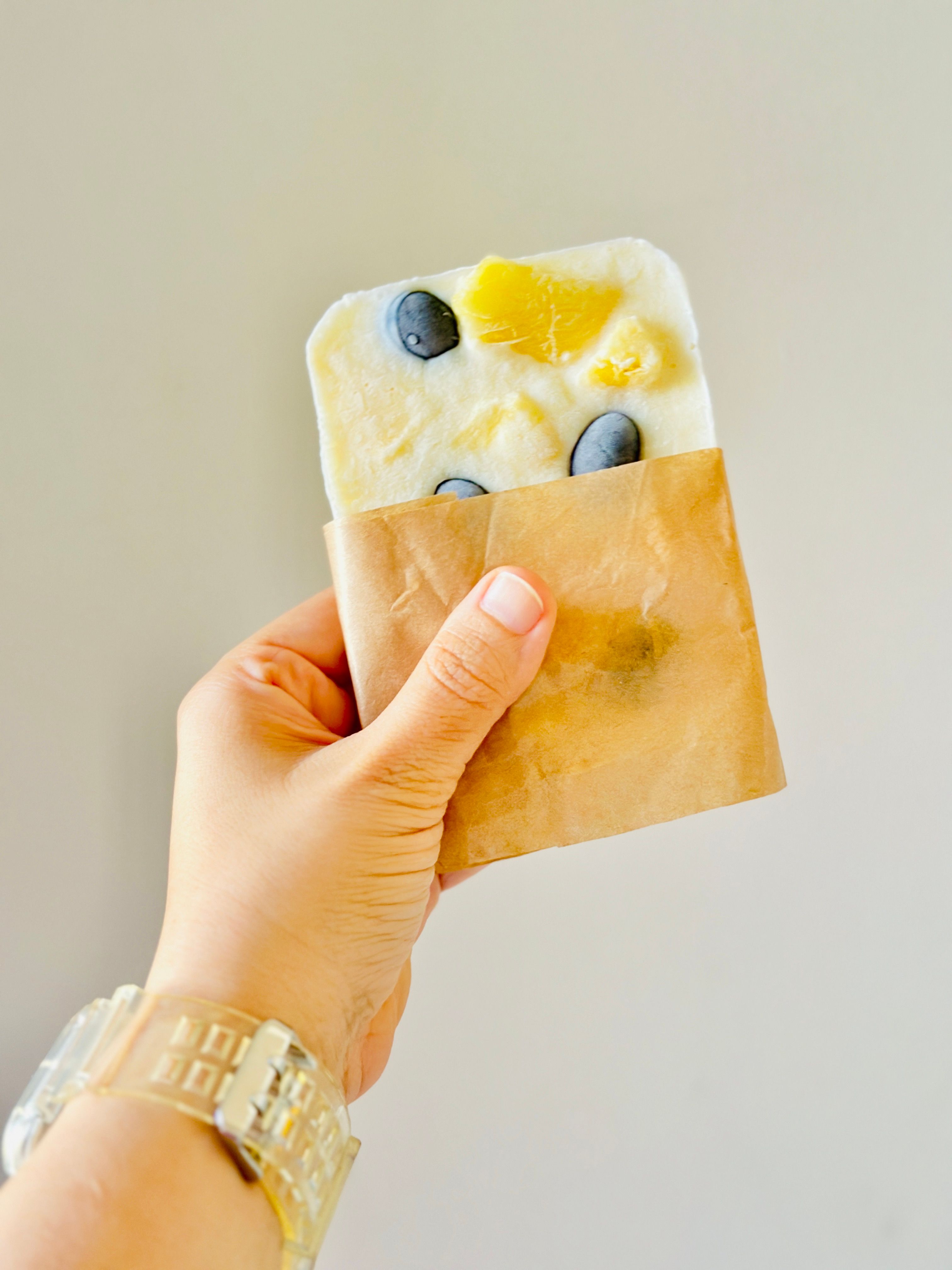 Layered frozen fruit yogurt popsicle
