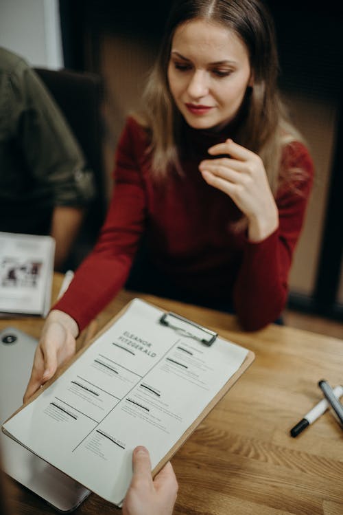 Free Woman Holding Clipboard Stock Photo
