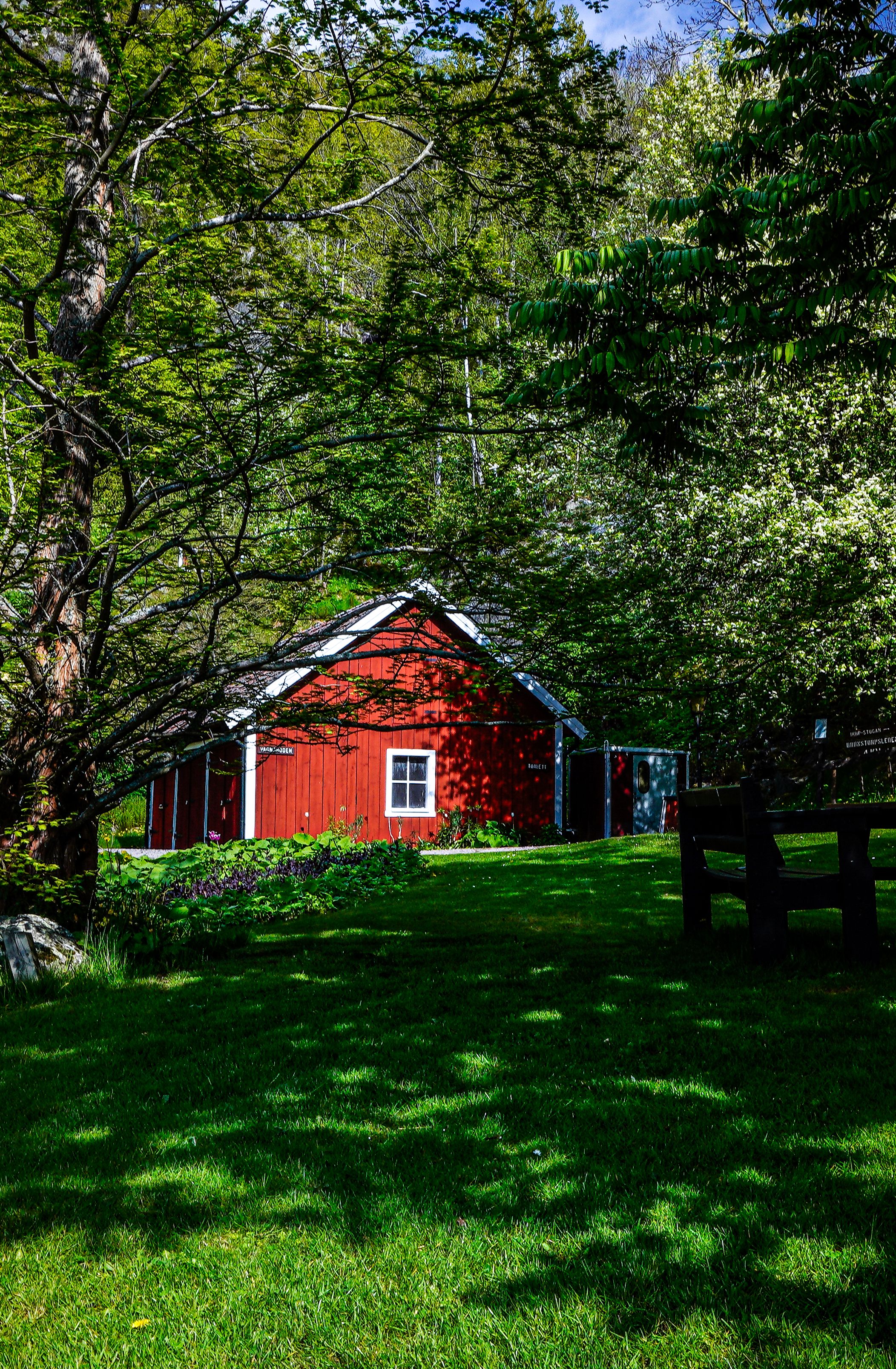 Brown Wooden House Near Green Trees · Free Stock Photo