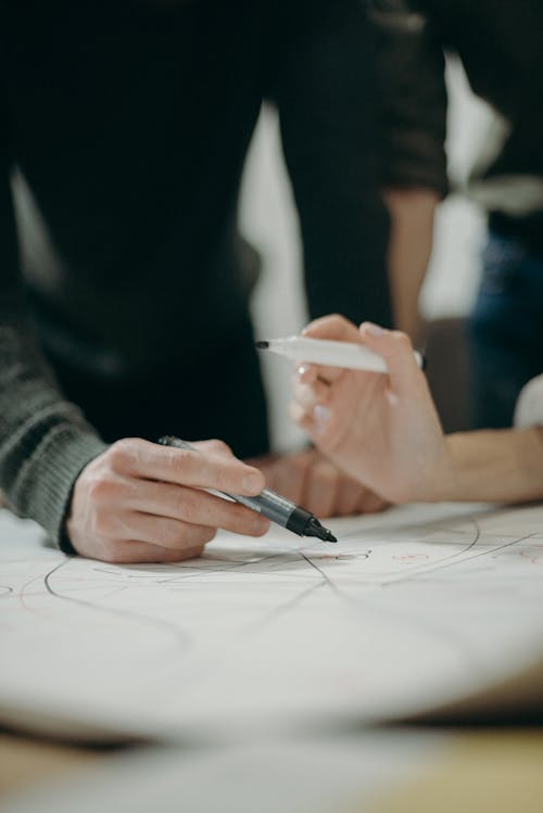 Man Writing on Paper