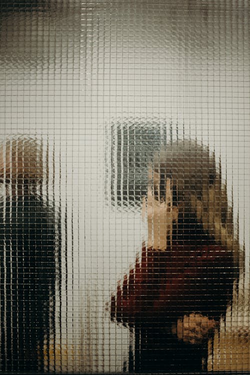 People Behind Glass