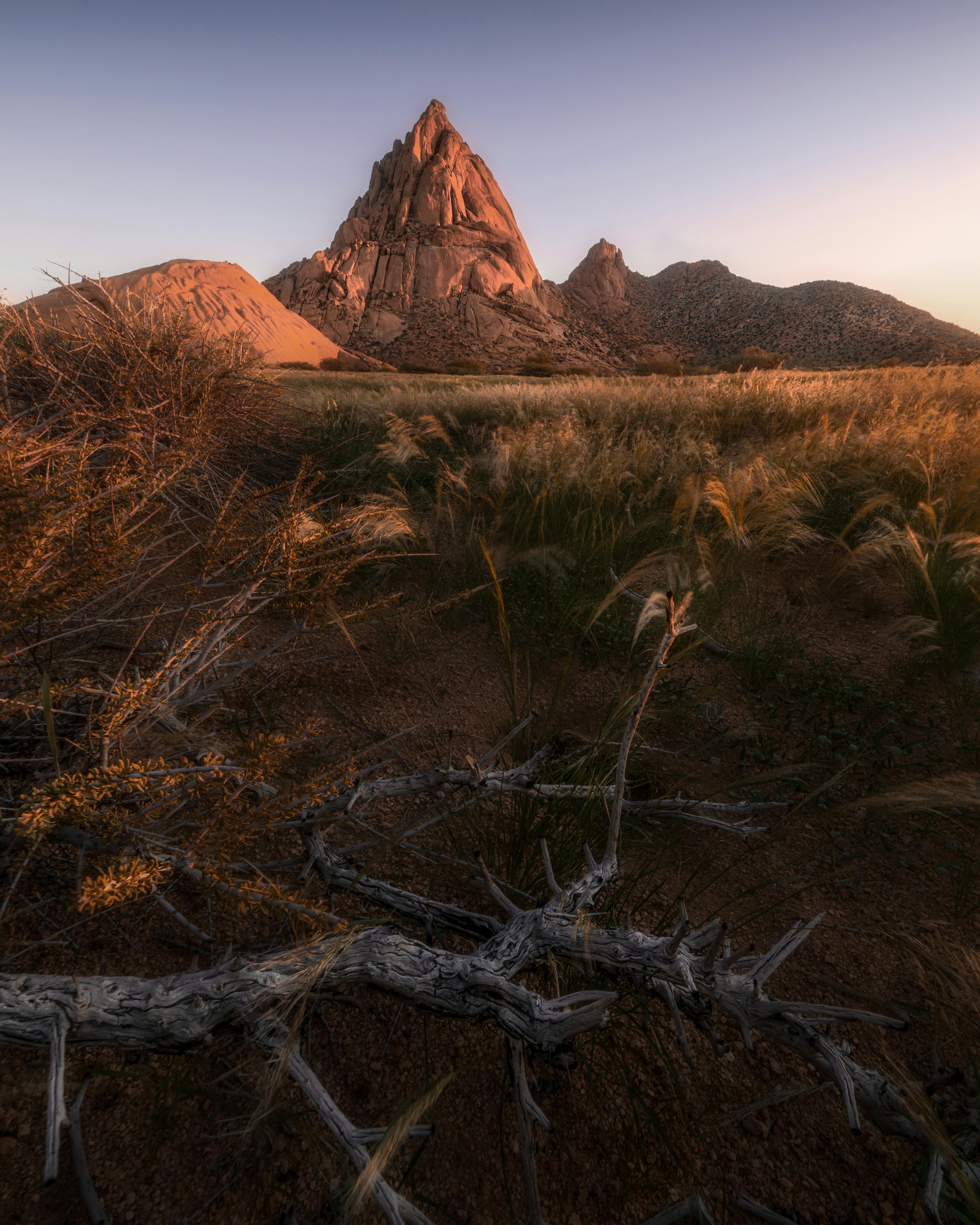 Breathtaking view of Spitzkoppe in Namibia during sunset with dramatic landscape.