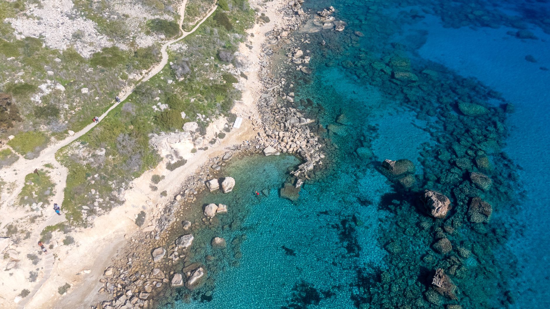Turquoise water and pale sand in a sheltered Cypriot bay
